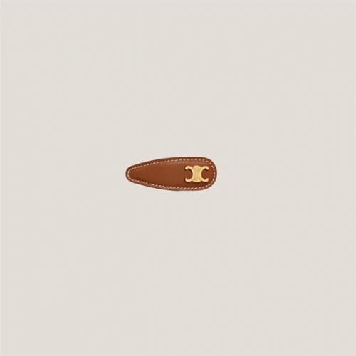 CELINE TRIOMPHE SNAP HAIR CLIP IN BRASS WITH GOLD FINISH, CALFSKIN AND STEEL TAN / GOLD